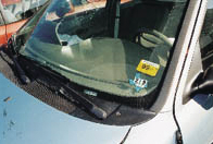 The Vehicle Identification Number (VIN) is stamped into the thin metal strip riveted to the dashboard.