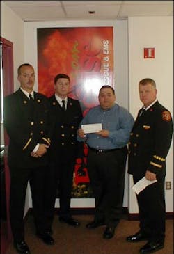 Delegation from Athens-Clarke County, Georgia delivers a check for $114,290 to Paul Andrews of Firehouse.com, to be added to &apos;The New York Firefighters 9-11 Disaster Relief Fund&apos;.