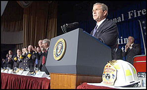 Pres. Bush is given a standing ovation during his remarks at the Nat'l Fire & Emer. Services dinner in Washington, April 18, 2002.