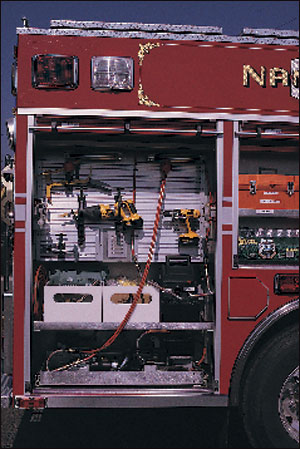 The Nanuet, NY, pumper carries a hydraulic spreader, cutter and ram, together with battery-powered hand tools and dual reels all in one compartment. Note that all equipment is labeled by position, making in much easier to 'take up' after an incident.