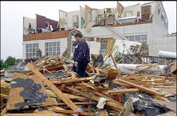 An emergency worker picks his way throught the rubble of the Davis-Bar-B-Que restaurant outside of Tate, Ga., Monday, Nov. 11, 2002. Several homes were destroyed also by overnight storms in the area.