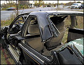 A Honda Accord sits behind the Fire Department on Framingham's Irving Street Sunday.