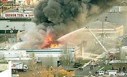Firefighters from several departments pour water on the Farwest Truck Firefighters from several departments pour water on the Farwest Truck