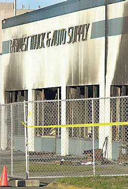 The charred shell of the store. The charred shell of the store.