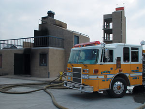A Santee engine company operates in front of the environmental building, which is capable of performing &ldquo;hot&rdquo; fires.