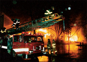Fitchburg Ladder 3 readies its ladder pipe for defensive operations.