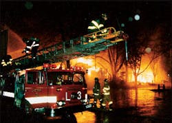 Fitchburg Ladder 3 readies its ladder pipe for defensive operations. Fitchburg Ladder 3 readies its ladder pipe for defensive operations.