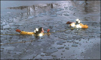 Wayne Township FF Ken Feckete and Capt. Taylor help the boy to safety.