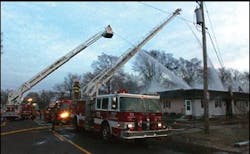 Firefighters continue to battle the blaze at 1412 S. 14th St., No. 2, at 7:30 a.m. today. An explosion brought Pekin police, firefighters ad Advanced Medical Transport personnel to the scene early this morning.