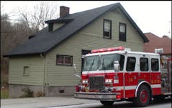 Firefighter&apos;s from Engine 21 hit the air horns as they pass retired Fire Captain George Stoll&apos;s &apos;little green house on the curve&apos;.
