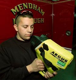 Mendham firefighter William Taquinto holds a thermal imaging device that he used to rescue a 3-year-old from a house fire Sunday night in Mendham.