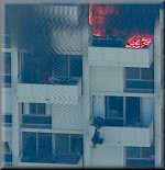 A rescue team member tries to save the man who apparently started the high-rise fire. The rescue failed and the man fell to his death.