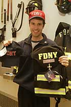 FIRE SALE: Fire-safety instructor Rick Trader shows off an FDNY-licensed cap and backpack, part of an expanded line of merchandise that now also includes bottled water, patches, beefcake calendars, toys and lunchboxes.