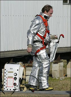 A Kennedy Space Center firefighter takes off his gear while awaiting word on the fate of the space shuttle Columbia, Saturday, Feb. 1, 2003, at the Kennedy Space Center in Cape Canaveral, Fla A Kennedy Space Center firefighter takes off his gear while awaiting word on the fate of the space shuttle Columbia, Saturday, Feb. 1, 2003, at the Kennedy Space Center in Cape Canaveral, Fla