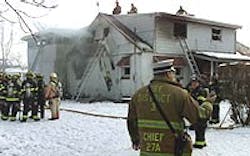Firefighters at the scene of the house fire at the corner of Frank and Booker streets in Franklin. Firefighters at the scene of the house fire at the corner of Frank and Booker streets in Franklin.