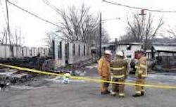 Firefighters discussed plans for storing equipment that was salvaged Saturday from the Wysox Fire Hall. The firefighters are standing in front of the remains of the hall, which was destroyed by fire Saturday morning Firefighters discussed plans for storing equipment that was salvaged Saturday from the Wysox Fire Hall. The firefighters are standing in front of the remains of the hall, which was destroyed by fire Saturday morning