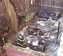 A firefighter yesterday inspects the remains of the patio of a devastated East 77th Street apartment, where three young people were badly burned in a fire. A firefighter yesterday inspects the remains of the patio of a devastated East 77th Street apartment, where three young people were badly burned in a fire.