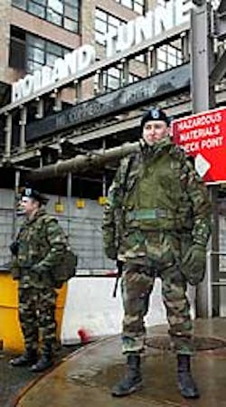 KEEPING GUARD UP: National Guardsmen Joseph Brusehaber and Jeremy Hitt man a checkpoint outside the Holland Tunnel yesterday. KEEPING GUARD UP: National Guardsmen Joseph Brusehaber and Jeremy Hitt man a checkpoint outside the Holland Tunnel yesterday.