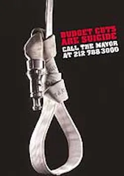 A poster opposes the mayor's firehouse closings.