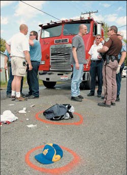 Kootenai County firefighters and a sheriff's deputy gather at 16th and Cecil in Post Falls following an accident Tuesday afternoon. James Robert Anglin, 18, a Post Falls High School senior, was killed when his bike collided with a Kootenai County Fire and Rescue water truck. From left: Firefighters Jim Oxenrider, Ken Peterson, Bryon Johnson, Fire Chief Lynn Borders, Sheriff's Officer Stu Miller and KCF Kootenai County firefighters and a sheriff's deputy gather at 16th and Cecil in Post Falls following an accident Tuesday afternoon. James Robert Anglin, 18, a Post Falls High School senior, was killed when his bike collided with a Kootenai County Fire and Rescue water truck. From left: Firefighters Jim Oxenrider, Ken Peterson, Bryon Johnson, Fire Chief Lynn Borders, Sheriff's Officer Stu Miller and KCF