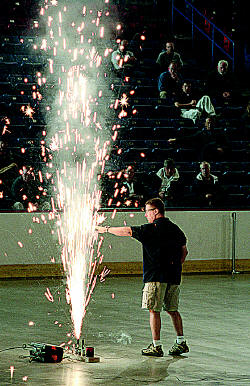 Matt Shea, of Atlas PyroVision Productions in Jaffrey, puts his hand into a 20 by 20 Stage Gerb. It burns for 20 seconds and reaches heights of about 20 feet. It's similar to the stage pyrotechnics used at The Station nightclub in Rhode Island.