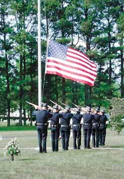 A 21-gun salute and a flag lowered to half-staff were done in honor of Jason Ellis who was killed in a training accident May 18. A 21-gun salute and a flag lowered to half-staff were done in honor of Jason Ellis who was killed in a training accident May 18.