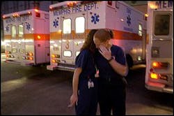 Nurse Angela Morgan (left) comforts paramedic Candace Hardwick outside The Med Sunday night after firefighter Charles Zachary was brought in. He later died. Nurse Angela Morgan (left) comforts paramedic Candace Hardwick outside The Med Sunday night after firefighter Charles Zachary was brought in. He later died.