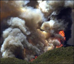 A wildfire continues to rage on top of Mount Lemmon near Tucson, Ariz., Sunday, June 22, 2003. The uncontrolled wildfire that destroyed more than 250 homes in this mountaintop community moved on a course Sunday that would take it into an area where terrain and lighter vegetation will make it easier to fight, fire officials said. A wildfire continues to rage on top of Mount Lemmon near Tucson, Ariz., Sunday, June 22, 2003. The uncontrolled wildfire that destroyed more than 250 homes in this mountaintop community moved on a course Sunday that would take it into an area where terrain and lighter vegetation will make it easier to fight, fire officials said.