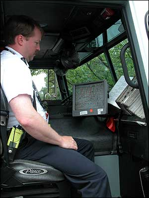 Lt. Dallas Lipp demonstrates truck computer interface.
