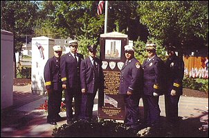 Loveland-Symmes FD Memorial Service at our seven-foot tall Ganite New York City Heroes Memorial in downtown Loveland, Ohio. (L to R) Chief of Dept Otto Huber, Battalion Chief Billy Goldfeder, FDNY Lt. Steve Mormino, FDNY Firefighter Dan Bove, Asst. Chief Tom Turner, Battalion Chief Drew Knapp