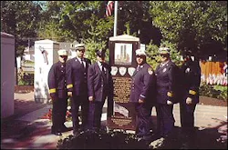 Loveland-Symmes FD Memorial Service at our seven-foot tall Ganite New York City Heroes Memorial in downtown Loveland, Ohio. (L to R) Chief of Dept Otto Huber, Battalion Chief Billy Goldfeder, FDNY Lt. Steve Mormino, FDNY Firefighter Dan Bove, Asst. Chief Tom Turner, Battalion Chief Drew Knapp