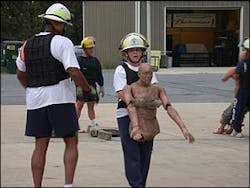 LT Charles Bailey asks LT Stacey Daniel where her dummy's legs went during this PT station. She said, LT Charles Bailey asks LT Stacey Daniel where her dummy's legs went during this PT station. She said,
