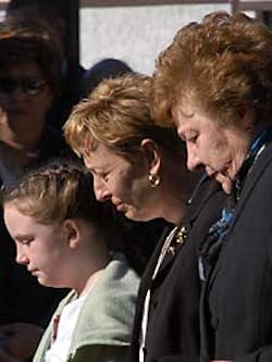Grieving mom Anne Downing, daughter Joanne and another family member shed tears at the funeral of tragic 5-year-old cancer victim Michael yesterday. Below, Anne with son Michael Grieving mom Anne Downing, daughter Joanne and another family member shed tears at the funeral of tragic 5-year-old cancer victim Michael yesterday. Below, Anne with son Michael