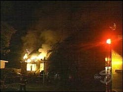 The house in flames in July. The house in flames in July.