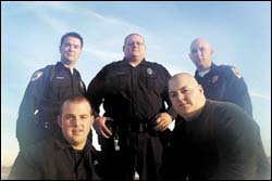 Those who plunged into a Shawnee Township pond Saturday night to rescue a man and woman from a submerged car are (clockwise from top left) Shawnee Township police officers Chris Miracle, Ted Falke and Shane Hartman and firefighters Bill McCullough and Ryan Schott.