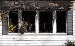 A firefighter with the Canton Fire Department uses a shovel to clear debris, while investigators search for clues to the cause of a fatal fire, Tuesday, Dec. 23, 2003, in Canton, Ohio. An early morning fire engulfed a house Tuesday, killing two adults and four children, the coroner's office said. A seventh person, a woman, was flown by helicopter to an Akron hospital in critical condition with burns, said Rick Walters, an investigator with the Stark County Coroner's Office. A firefighter with the Canton Fire Department uses a shovel to clear debris, while investigators search for clues to the cause of a fatal fire, Tuesday, Dec. 23, 2003, in Canton, Ohio. An early morning fire engulfed a house Tuesday, killing two adults and four children, the coroner's office said. A seventh person, a woman, was flown by helicopter to an Akron hospital in critical condition with burns, said Rick Walters, an investigator with the Stark County Coroner's Office.