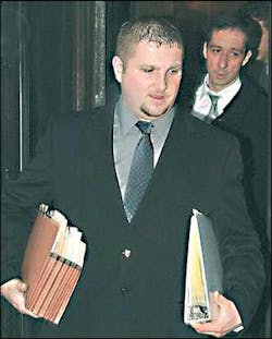 Steven Dugan, followed by his attorney, Tom Farrell, leaves federal court in Pittsburgh this week. Dugan, 26, a former chief of the Isabella Volunteer Fire Department, was convicted of mail fraud Wednesday.