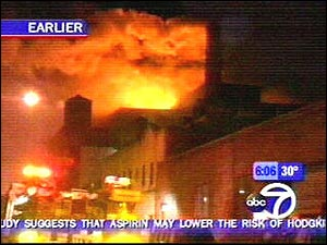 This is a four-alarm fire burning at the intersection of Water Street and Gold Street in a Brooklyn neighborhood known as Vinegar Hill in Brooklyn.