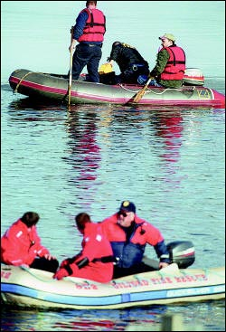 The emotional strain is evident in the faces of fire and rescue personnel while searching for Laconia Fire Department Lt. Mark Miller, who didn&rsquo;t surface during a training dive off the Weirs Beach Docks Thursday afternoon.