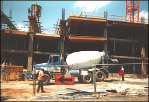 A trained eye would detect that this Suburban Hospital Bethesda MD Outpatient Center is a post tensioned concrete construction job and all that dry hard concrete is not attached to the building and is supported only by the fire vulnerable wooden falsework Smoke might obscure vision so the only sound precaution is for the FD to be aware on a daily basis of this deadly type of construction.