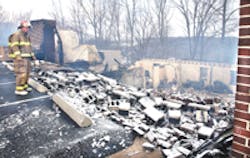 Norman Dudson, with the Sophia Area Fire Department, looks over the remains of the Hilltop Baptist Church, which was destroyed by fire early Monday morning. Norman Dudson, with the Sophia Area Fire Department, looks over the remains of the Hilltop Baptist Church, which was destroyed by fire early Monday morning.
