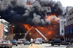 Fire engulfs an area near VCU in Richmond on Friday. A wind-whipped fire destroyed several buildings in downtown Richmond, including a four-story apartment house under construction, fire officials said.