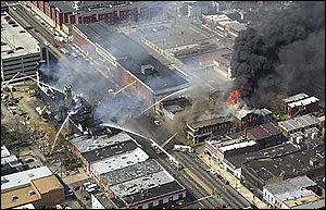 A heavy column of smoke rises over downtown Richmond as firefighters battle a blaze at Virginia Commonwealth University.