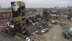 The cleanup continued yesterday at the apartment building on West Broad Street where the fire began. Officials are still trying to determine the cause of the blaze.