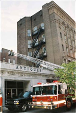 Members of the second due Truck Company assist command in sizing-up the involved structure by observing the rear of the structure and the involved exposures on Side C. Members of the second due Truck Company assist command in sizing-up the involved structure by observing the rear of the structure and the involved exposures on Side C.