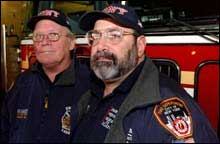 Mike Bellone (right), with Bob Barrett, wears FDNY garb on the Ground Zero tour, but doesn't have FDNY approval.