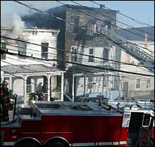 Firefighters yesterday battle the blaze, which killed a couple and their daughter, 5.