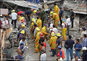 Rescue workers look for survivors among the debris after an explosion that left at least eight people dead and nine people injured at a restaurant in Nuevo Progreso, in the Mexico-U.S. border, Saturday 10 April 2004. A gas leak in a restaurantcaused the explosion, authorities said.
