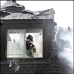 A Norwood firefighter battles a two-alarm blaze inside a Normandy Drive apartment complex yesterday. A Norwood firefighter battles a two-alarm blaze inside a Normandy Drive apartment complex yesterday.