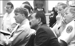 (Far left) Michael J. Weiner, president of the Community Volunteer Fire Rescue Association, (front) Gordon A. Aoyagi, the county&apos;s fire administrator, and (far right) Thomas W. Carr Jr., who supervises the county&apos;s career firefighters, are among those listening intently as the County Council debates the reform bill that will put all career and volunteer fire and rescue personnel under a single administrator